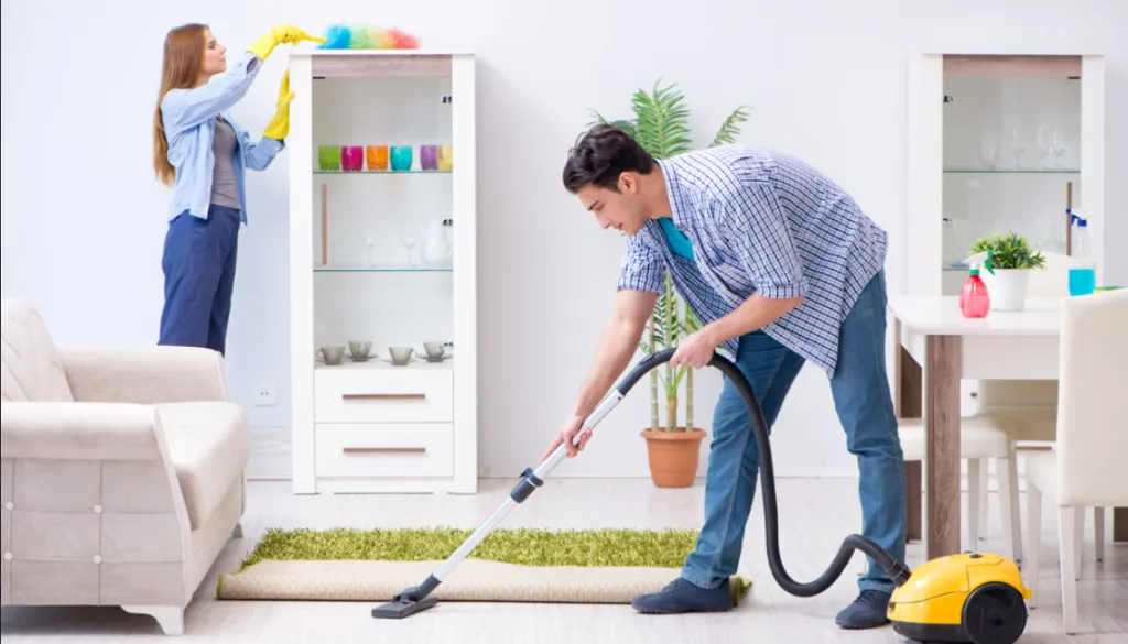 couple cleaning a room