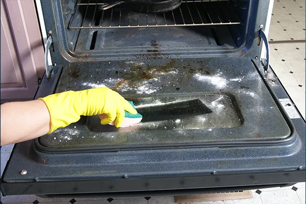 cleaning an oven's door