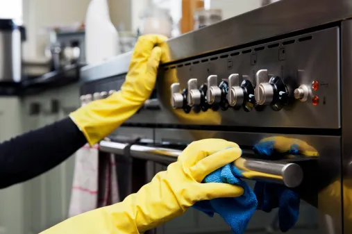 cleaning a kitchen with gloves