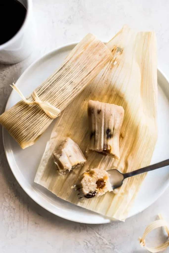 tamal cut with a fork