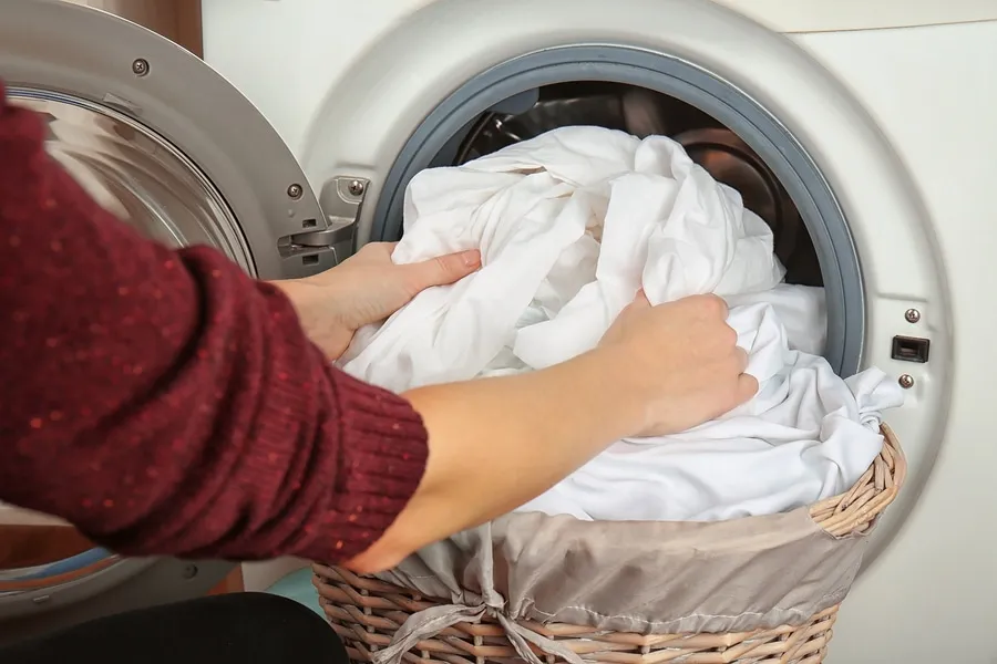 introducing clothes into the laundry