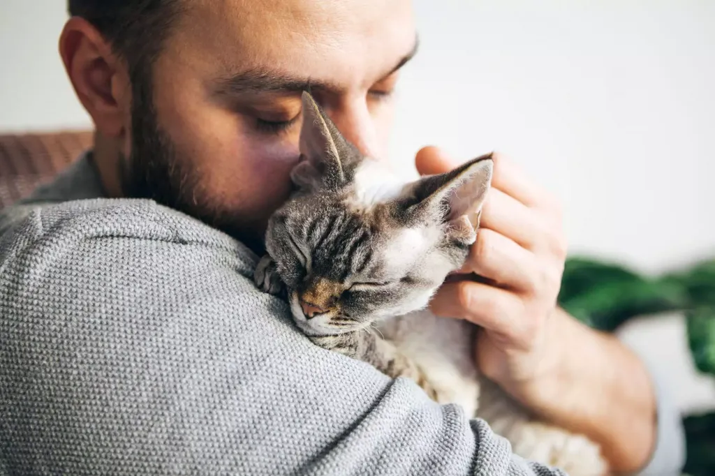 man loving cat