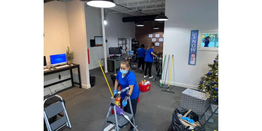 corporate cleaning team cleaning an office