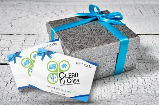 Clean Tu Casa gift card next to a gift box